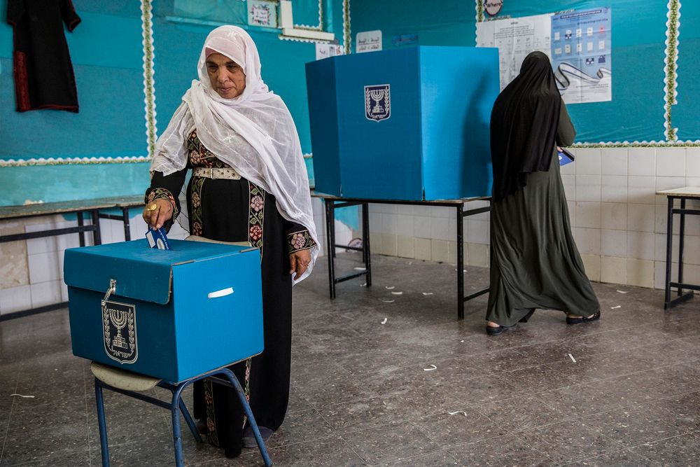 Israeli Bedouin woman votes during general elections in the city of Rahat, Tuesday, April 9, 2019.