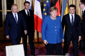 French President Emmanuel Macron, second left, Russian President Vladimir Putin, left, German Chancellor Angela Merkel and Ukrainian President Volodymyr Zelenskiy arrive for a working session at the Elysee Palace Monday, Dec. 9, 2019 in Paris