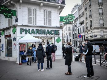 People wait in line for Covid tests in Paris, France on December 23, 2021.