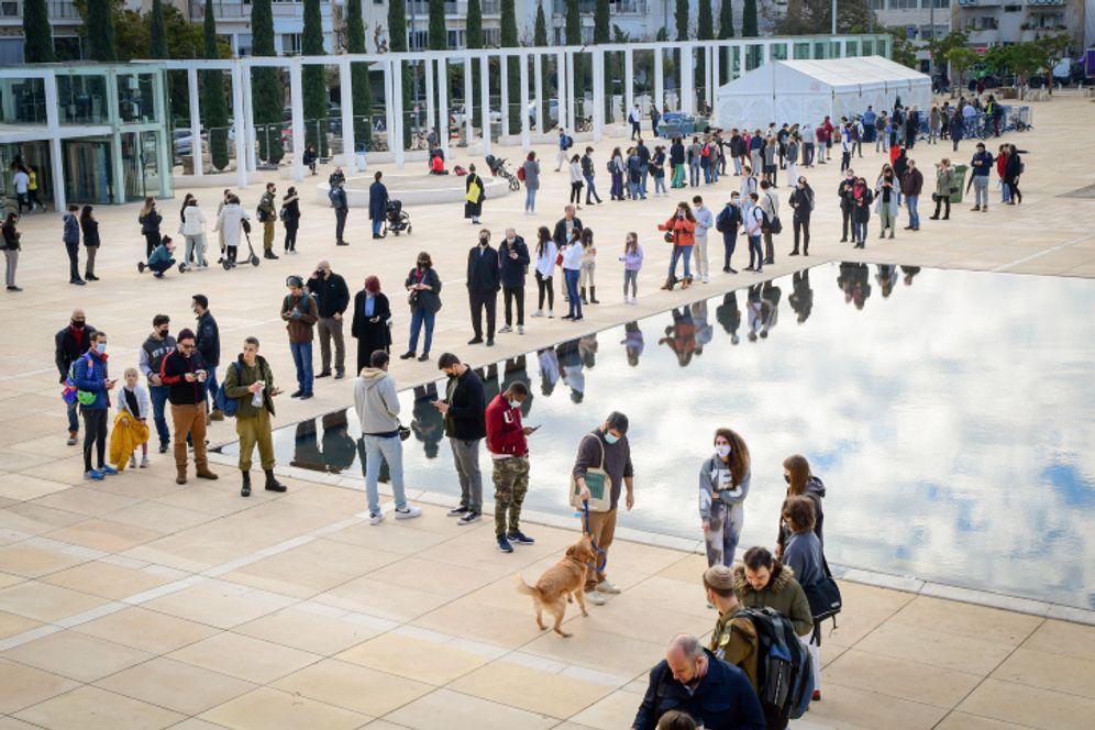 People line up to be tested at a testing center in HaBima Square in Tel Aviv on January 4, 2021.