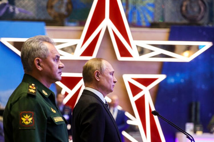 Russia's President Vladimir Putin (R) and Defense Minister Sergei Shoigu visit a military exhibition in Moscow, Russia, December 21, 2021.