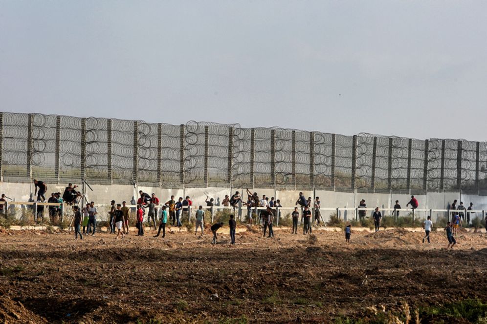 Palestinian protesters clash with Israeli forces during a protest at the Israel-Gaza border on August 21, 2021.