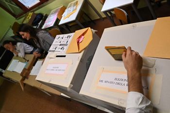 A man casts his vote at a polling station on September 25, 2022 in Rome, Italy, as the country is voting for the legislative election.