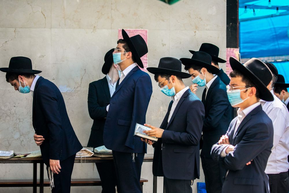 ILLUSTRATION - Ultra-Orthodox Jews walk in the Haredi town of Bnei Brak on October 14, 2020, during a nationwide lockdown against the spread of COVID-19.