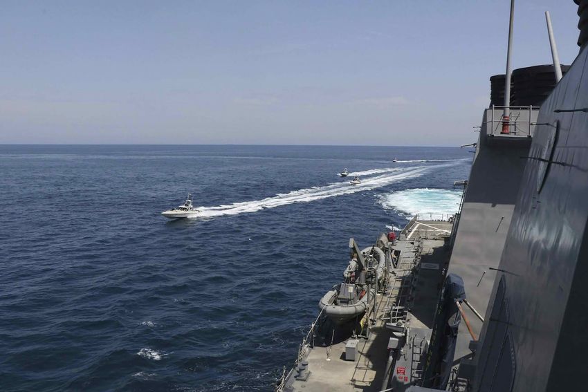 Iranian Revolutionary Guard vessels sail close to U.S. military ships in the Persian Gulf near Kuwait. April 15, 2020.