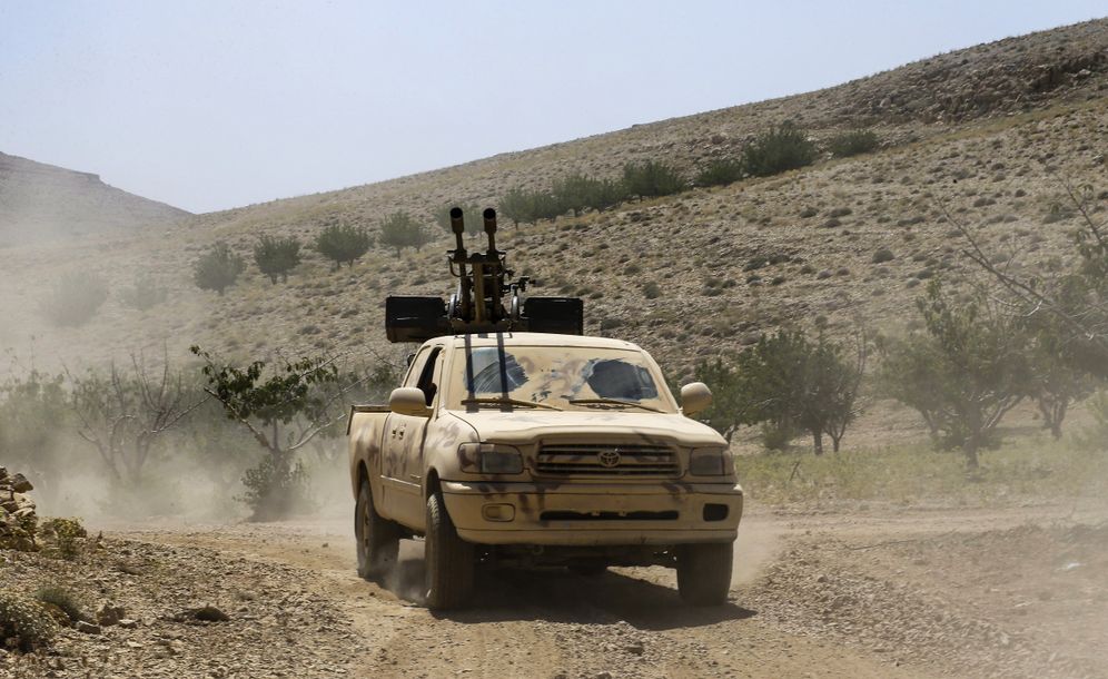 File: A Hezbollah vehicle with a mounted anti-aircraft gun near the Syrian town of Flita on the border with Lebanon, August 2, 2017.