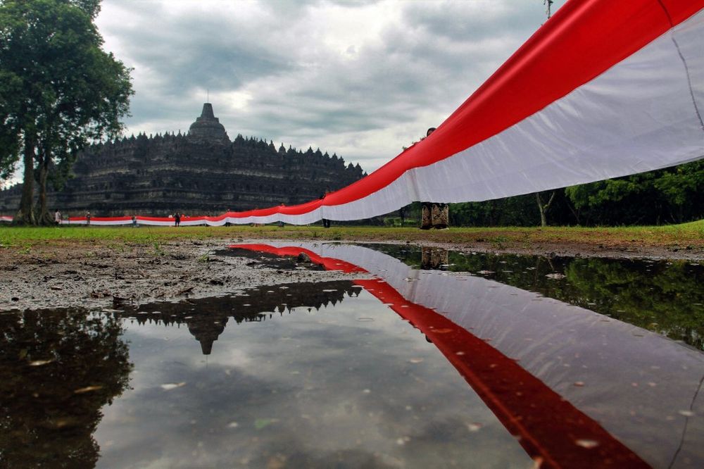 A 3,280-foot-long Indonesian national flag is seen with the 9th century Borobudur temple as a backdrop in Magelang, Indonesia, on June 1, 2022.
