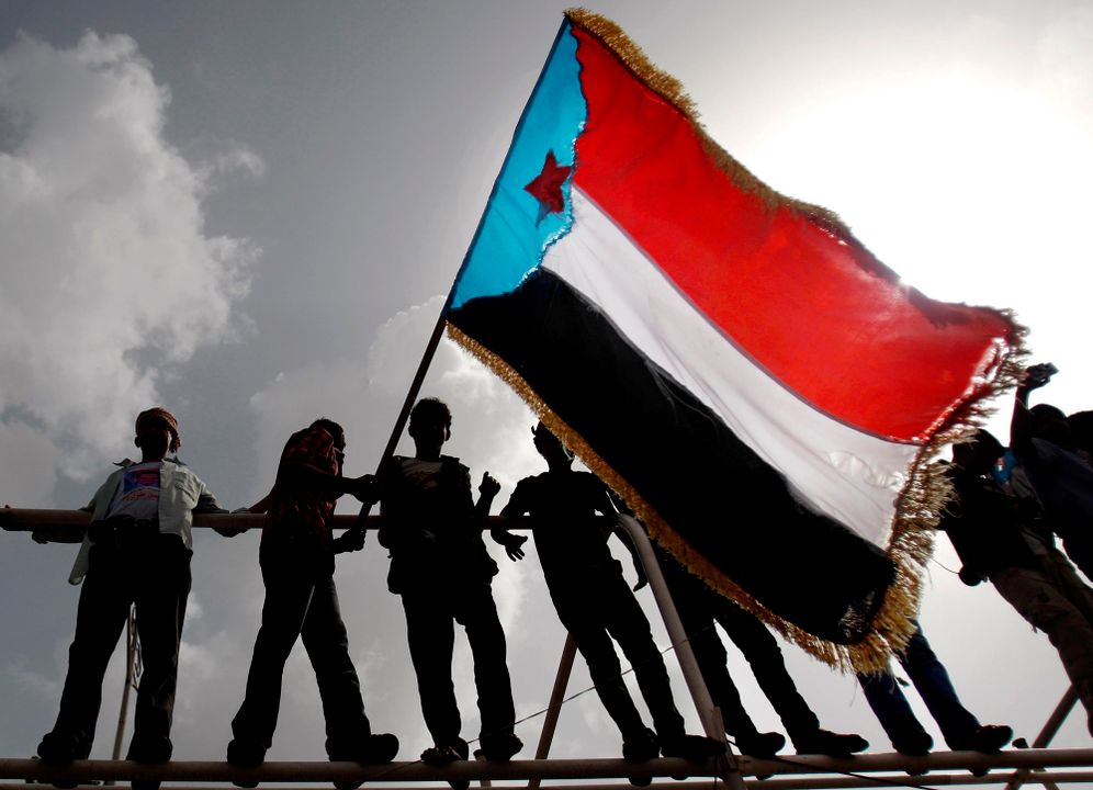 File photo of Yemeni supporters of the Southern Separatist Movement holding a flag of the former South Yemen, during a rally in Aden, Yemen