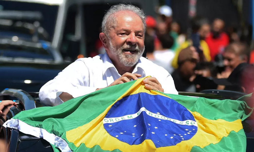 Luiz Inacio Lula da Silva, known as Lula, waves a Brazilian flag on October 30, 2022.