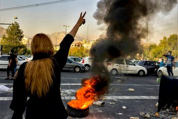 Iranians protests the death of 22-year-old Mahsa Amini after she was detained by the morality police, in Tehran, Iran.