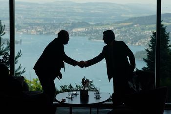 Delegation staff members meet in the lobby on the first day of a quadrilateral meeting between the U.S., Iran, Pakistan, and Qatar at the Buergenstock Resort Lake Lucerne, near Stansstad, Switzerland, Sunday, June 21, 2026