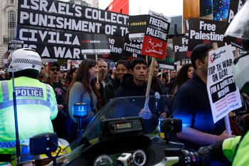 Police motorcyclists try to get through the crowd of protesters during a pro Palestinian demonstration in London, United Kingdom.