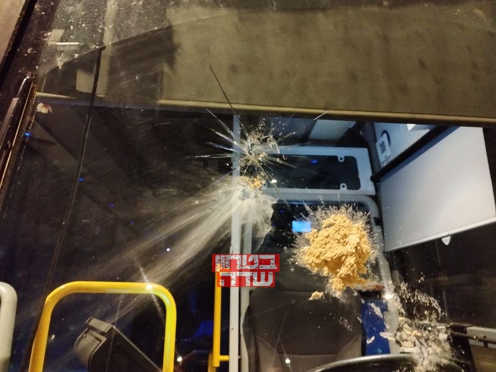 Bullet hole seen on a bus after a shooting attack near the Ofra settlement in the West Bank.
