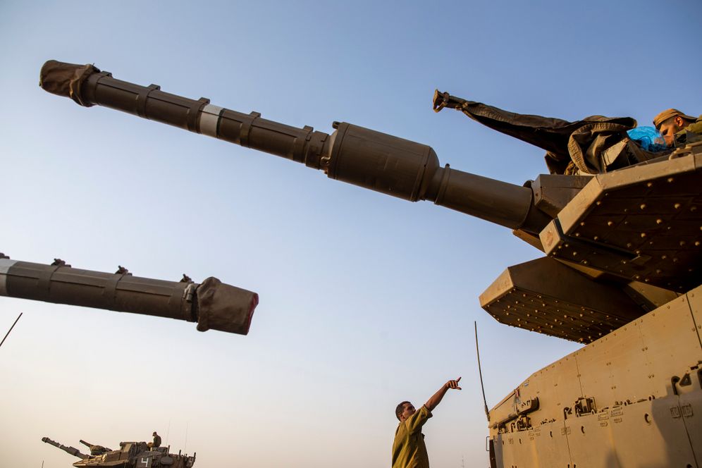 Israeli soldiers work on tanks in Israel's Golan Heights near the border with Syria, not far from Lebanon border, on July 28, 2020.