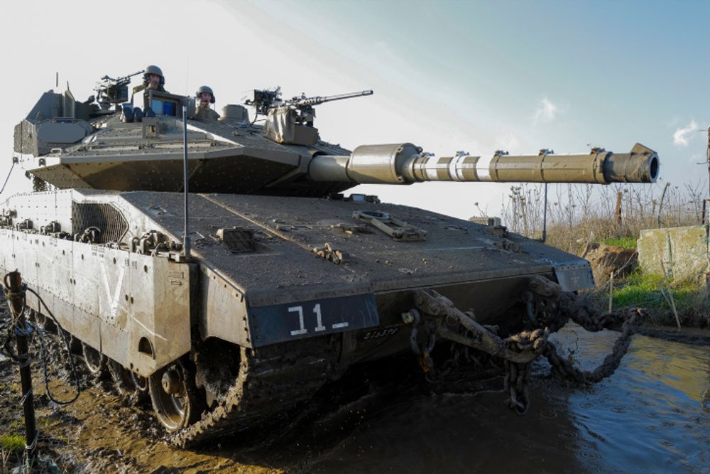 An Israeli Merkava tank takes part in a brigade maneuver in the Golan Heights on January 3, 2022.