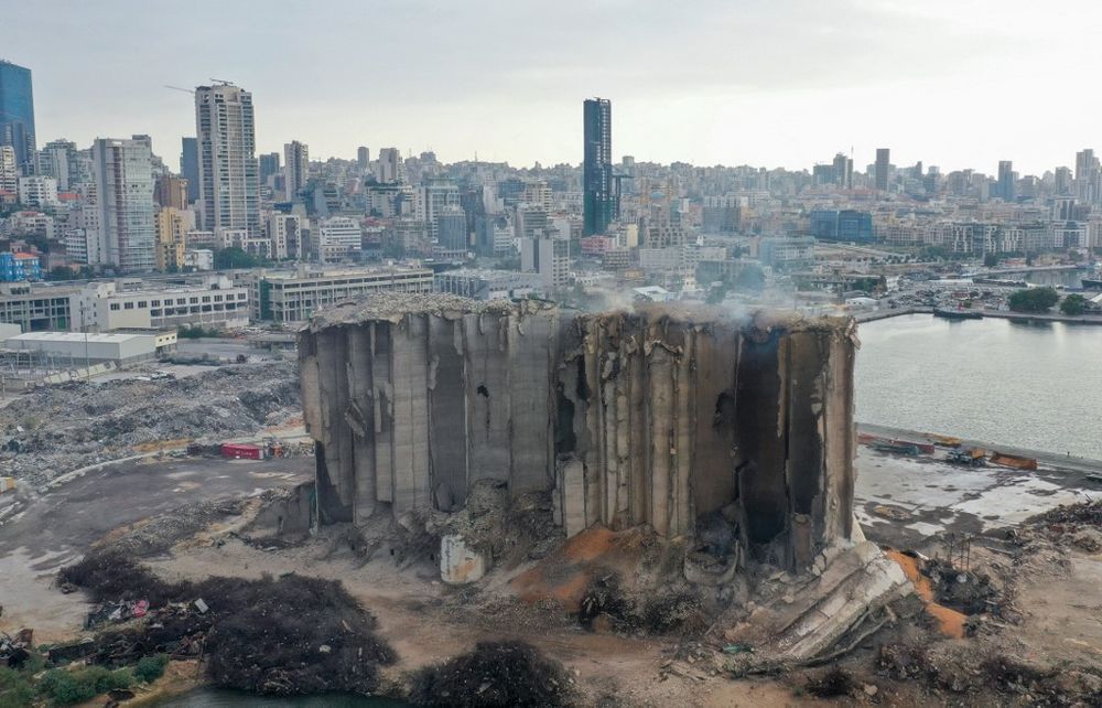 An aerial picture shows a view of the heavily damaged grain silos at the port of the Lebanese capital Beirut, on July 31, 2022, following a partial collapse due to an ongoing fire since the beginning of the month.