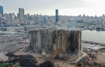 An aerial picture shows a view of the heavily damaged grain silos at the port of the Lebanese capital Beirut, on July 31, 2022, following a partial collapse due to an ongoing fire since the beginning of the month.