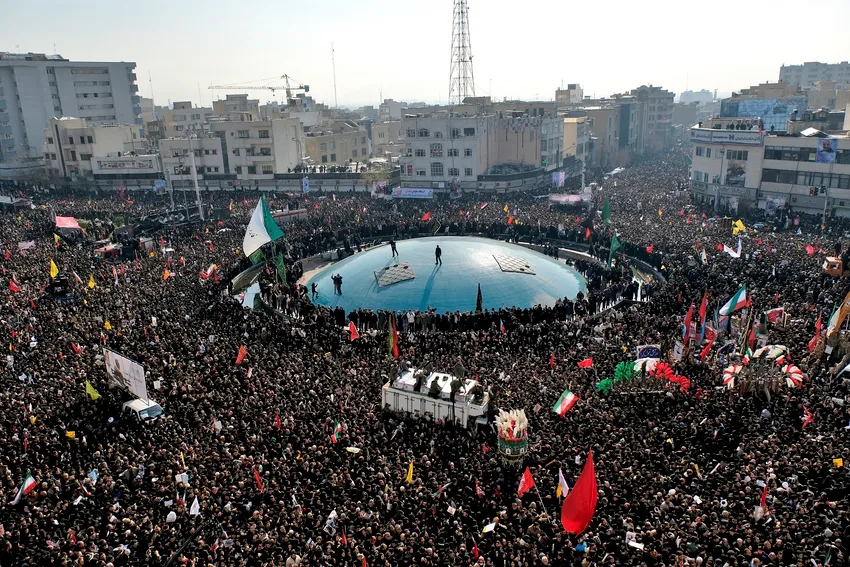 Coffins of Gen. Qassem Soleimani and others who were killed in Iraq by a U.S. drone strike, are carried on a truck surrounded by mourners during a funeral procession at the Enqelab-e-Eslami (Islamic Revolution) square in Tehran, Iran, Monday, Jan. 6, 2020
