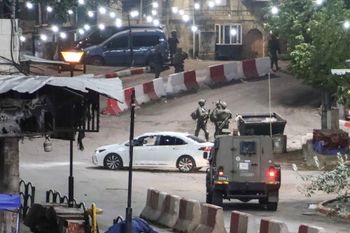 Israeli security forces near the site of a car ramming attack, in the West Bank city of Hebron, December 6, 2025.  

