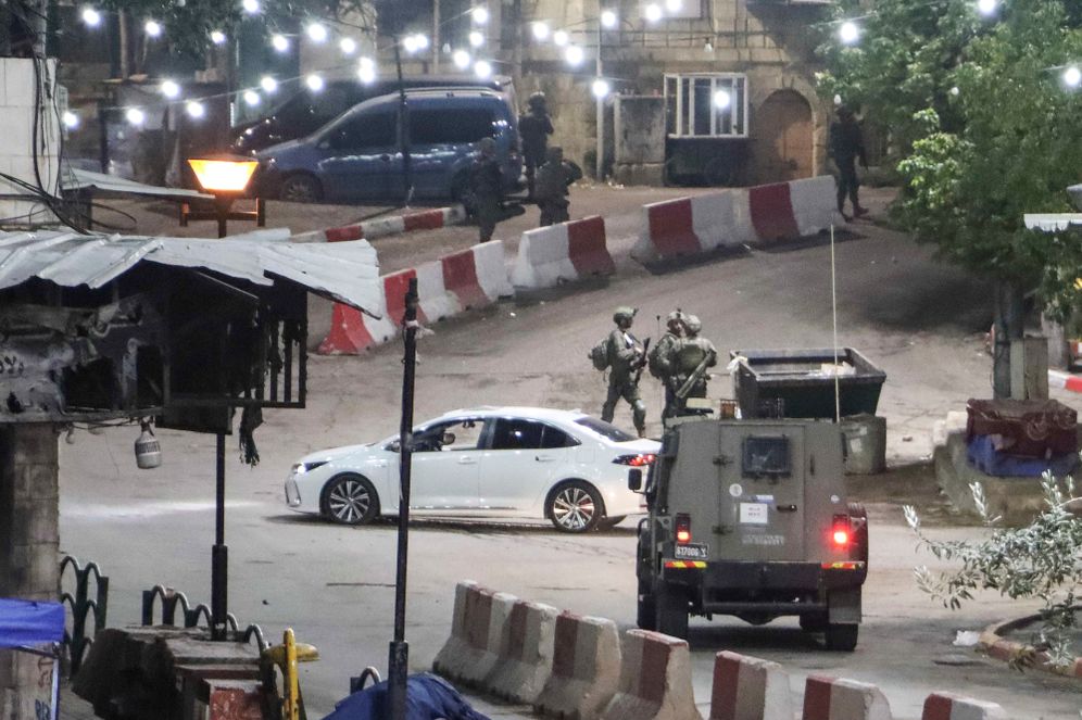 Israeli security forces near the site of a car ramming attack, in the West Bank city of Hebron, December 6, 2025.
