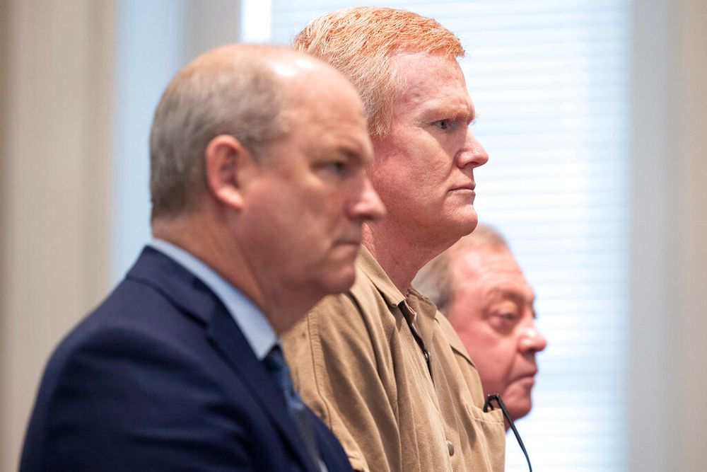 Alex Murdaugh (C) is sentenced to two consecutive life sentences for the murder of his wife and son in South Carolina, United States.