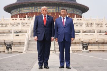 President Donald Trump, left, stands with Chinese President Xi Jinping at the Temple of Heaven on Thursday May 14, 2026, in Beijing. 