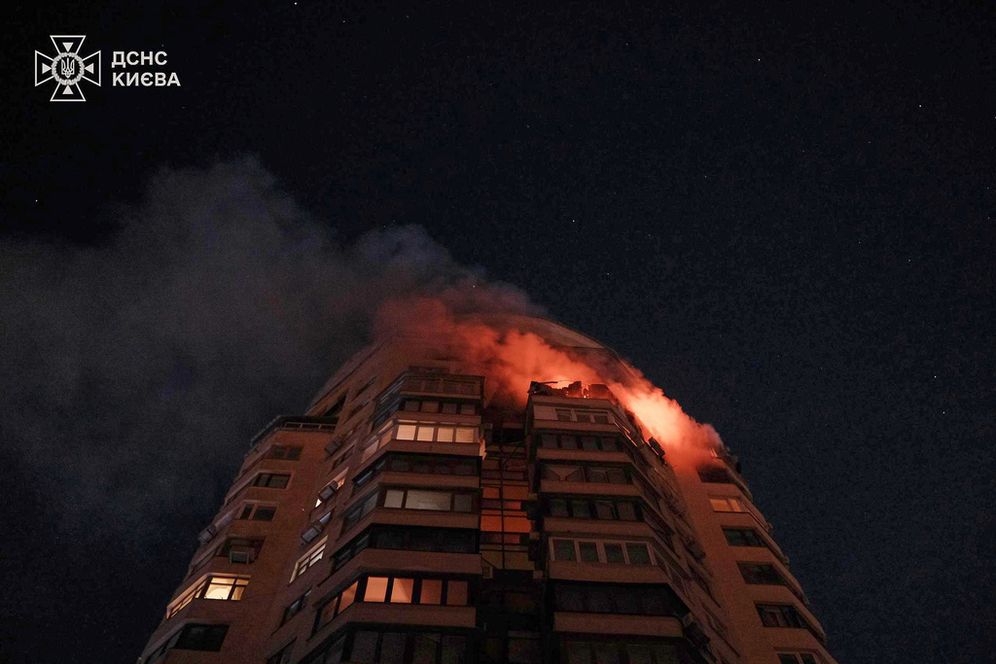 Emergency services personnel work to extinguish a fire at a multi-storey apartment building following a Russian attack in Kyiv, Ukraine, Tuesday, Feb. 3, 2026