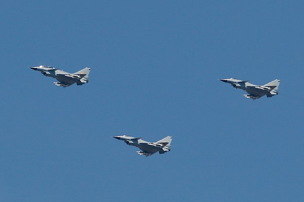 AP Photo/Mark Schiefelbein J-10 fighter jets fly in formation during a parade commemorating the 70th anniversary of Japan's surrender during World War II in Beijing, Thursday, Sept. 3, 2015. The spectacle involved more than 12,000 troops, 500 pieces of military hardware and 200 aircraft of various types, representing what military officials say is the Chinese military's most cutting-edge technology.