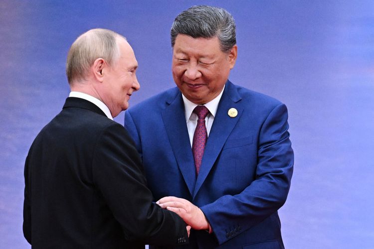 FILE - Russian President Vladimir Putin, left, and Chinese President Xi Jinping greet each other in Tianjin, China, on Aug. 31, 2025.