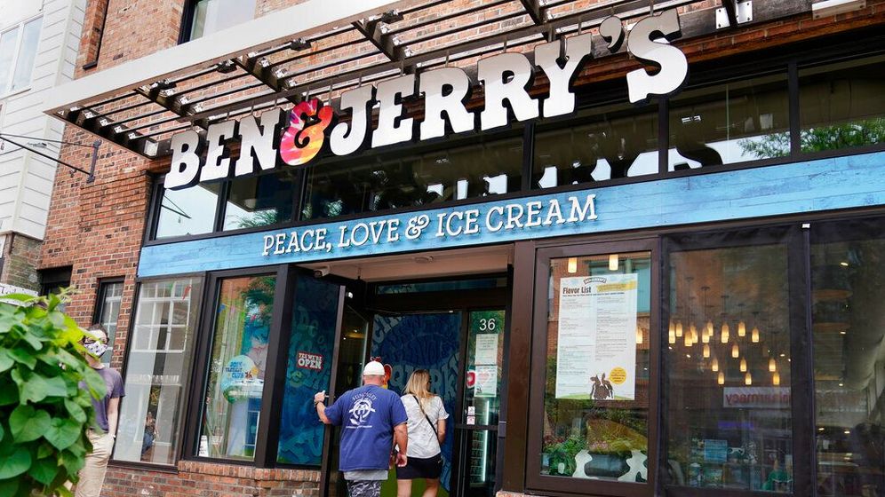 FILE - Two patrons enter a Ben & Jerry's Ice Cream shop, Tuesday, July 20, 2021, in Burlington.