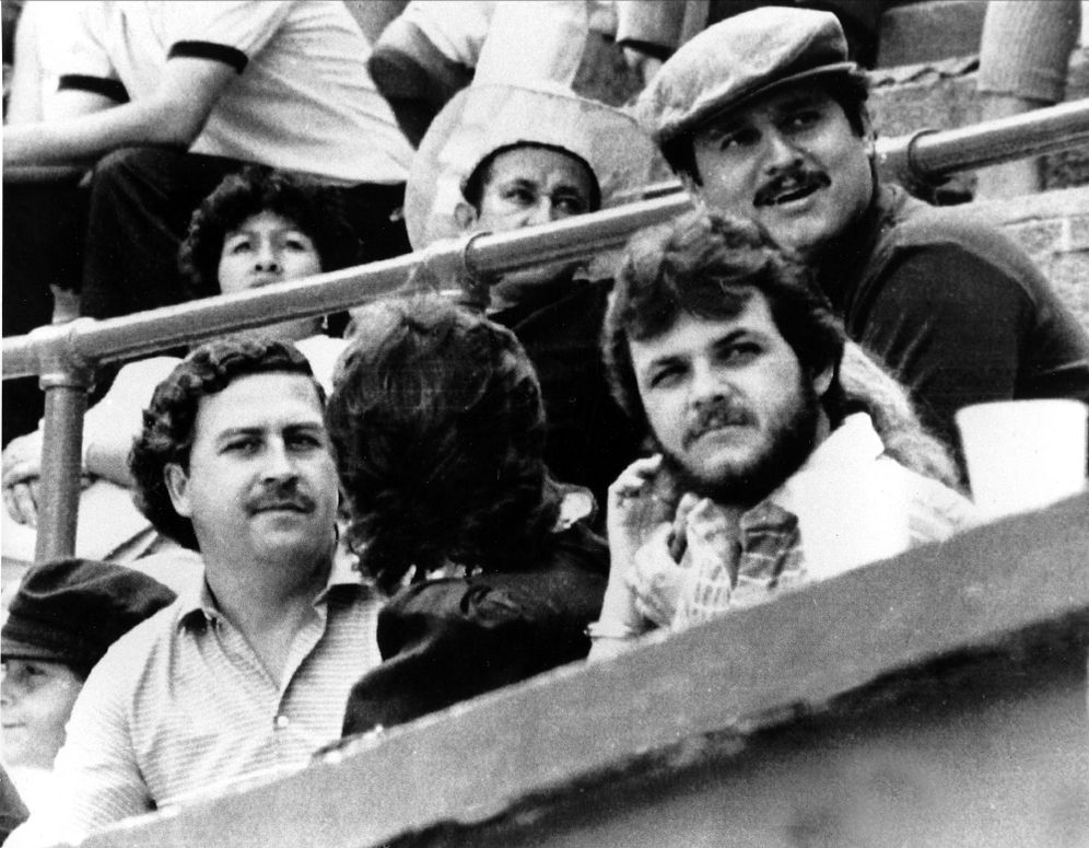 Pablo Escobar, left, and Jorga Luis Ochoa, right with hat, the two leaders of the Medellin cocaine cartel, are shown at a bullfight in Medellin, Colombia, in 1984