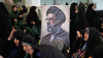 Women gather around a portrait of Iran's Supreme Leader, Ayatollah Mojtaba Khamenei, during a ceremony honoring the armed forces and those killed in the war with Israel and the U.S. at the Imam Khomeini Grand Mosque in Tehran, Iran, Sunday, May 24, 2026. 
