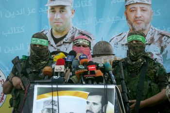 Abu Obeida, spokesman of al-Qassam Brigades, the military wing of Hamas movement, speaks during an anti-Israel military parade in Rafah in the southern Gaza Strip
