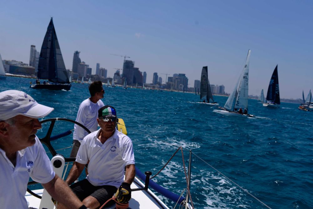 Israelis sailing in the Mediterranean Sea, with Tel Avi in the background, June 17, 2017.