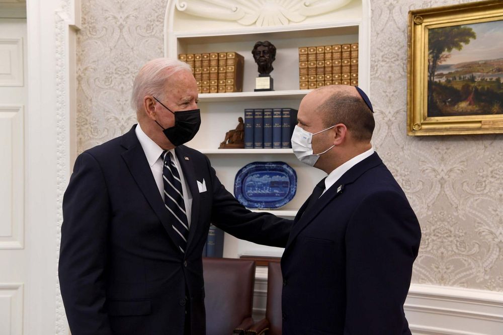 US President Joe Biden, left, meets with Israeli Prime Minister Naftali Bennett at the Oval Office at the White House in Washington, DC on August 27, 2021.