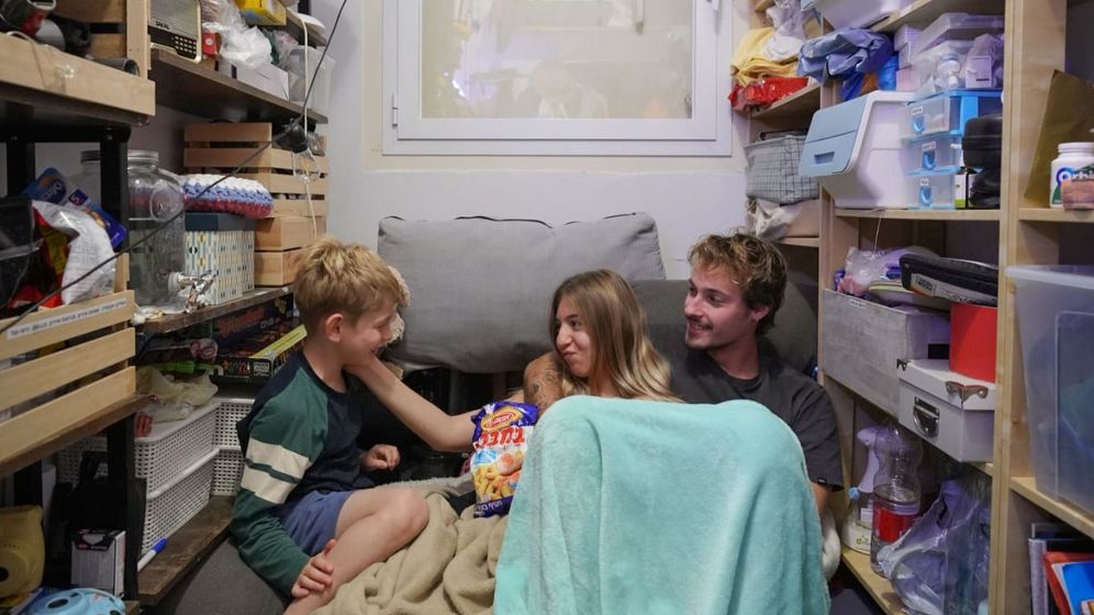 People take cover in their shelter as sirens warn of incoming missile fired from Iran, in central Israel, March 4. 2026