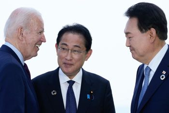 U.S. President Joe Biden (L) talks with Japanese Prime Minister Fumio Kishida (C) and South Korean President Yoon Suk Yeol in Hiroshima, Japan.
