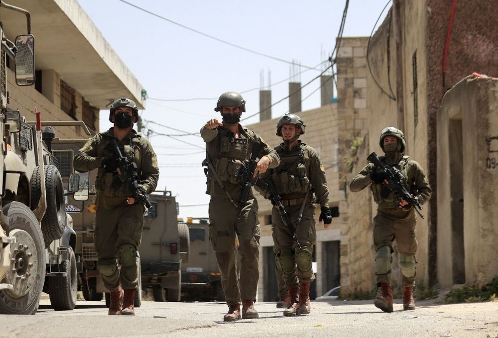 Israeli soldiers take part in a security operation in the Palestinian village of Aqraba, east of Nablus in the West Bank, on May 4, 2021