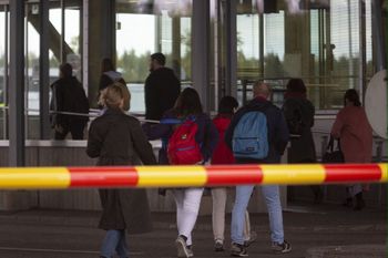 Passengers of a bus from Russia to Finland walk to the border control at the Vaalimaa border check point in Virolahti, Finland, on September 23, 2022.