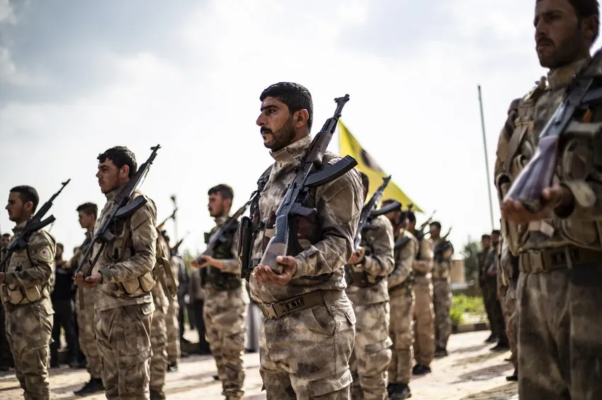 Members of the Kurdish-led Syrian Democratic Forces (SDF) attend the funeral of a fighter in SDF who was killed the previous week in the eastern Deir Ezzor province, in northeastern Syrian Kurdish-majority city of Qamishli on April 10, 2019.