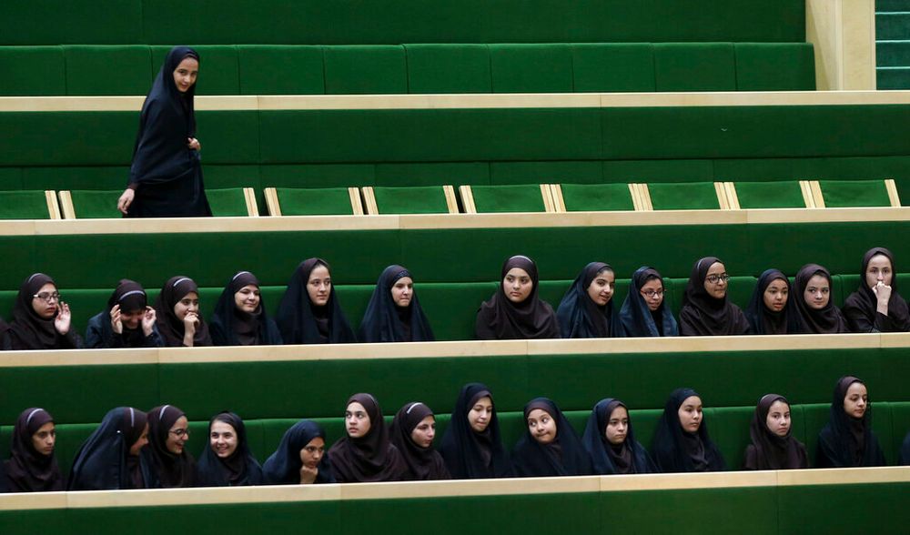 Iranian school girls attend a parliamentary debate in Tehran, Iran.