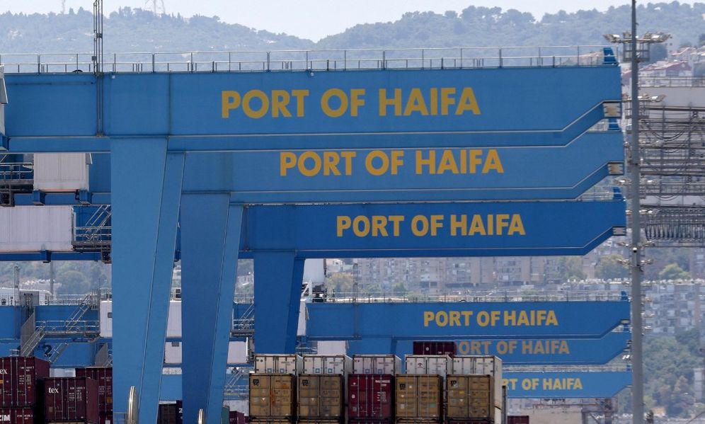 Containers and cranes on a dock of the northern Israeli city of Haifa port, on June 24, 2021.