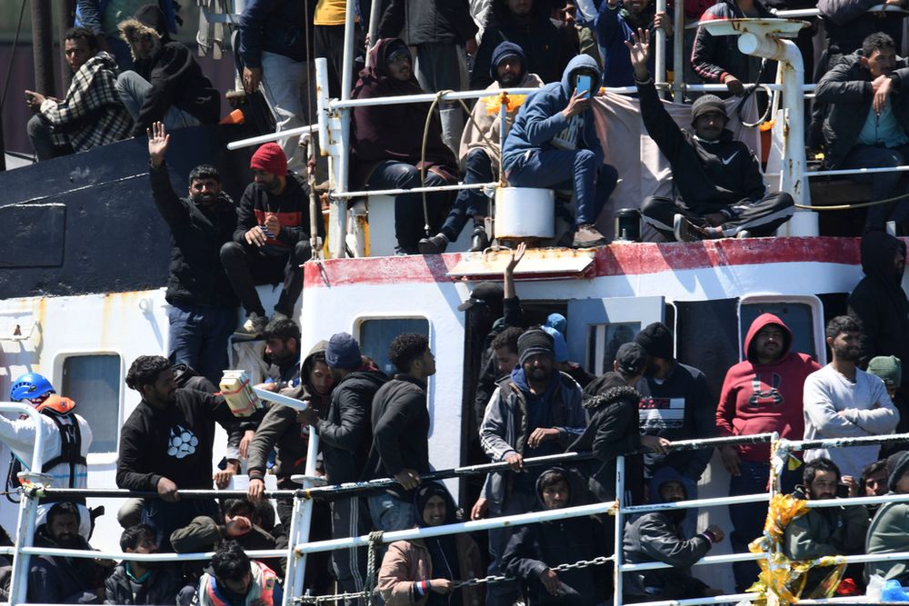 A ship carrying some 700 migrants enters the Sicilian port of Catania, Italy.