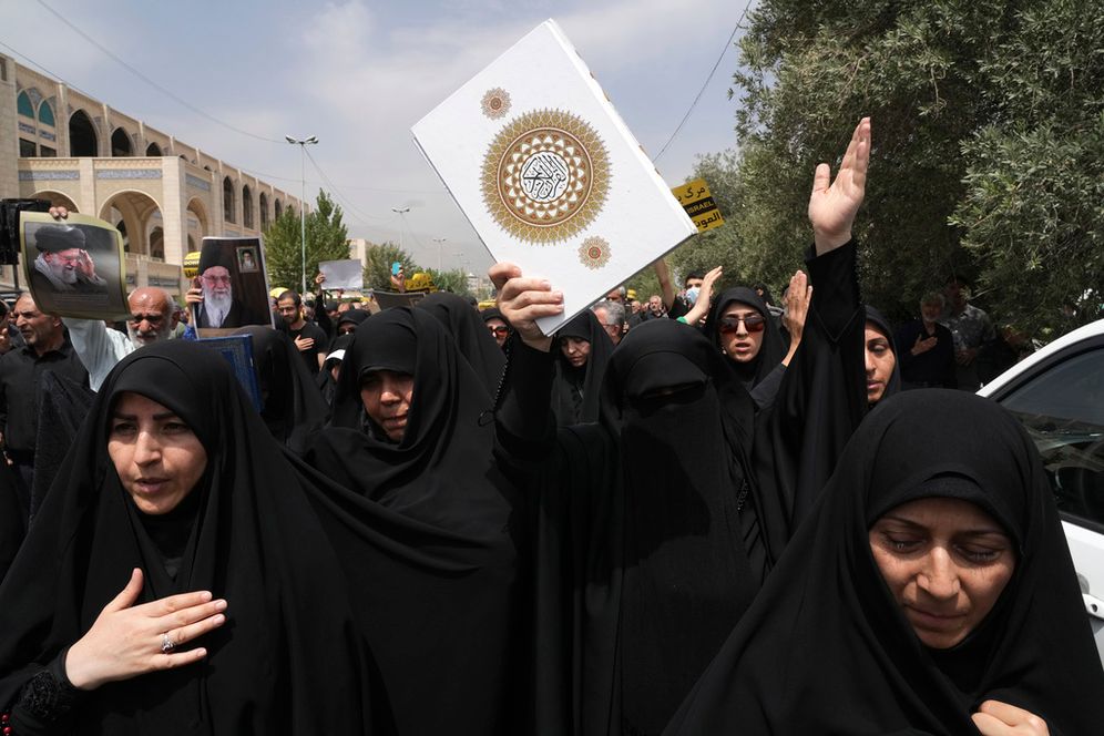 Worshippers hold the Quran during a protest in Tehran, Iran.