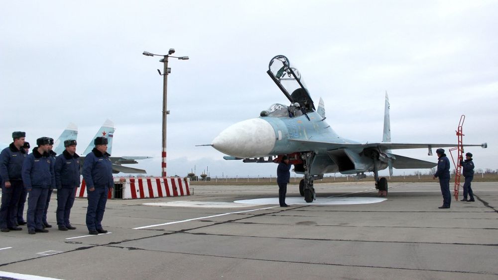 A Russian Su-27 SM fighter jet lands on the airfield of Belbek military airport outside a major port on the Black Sea Sevastopol, Crimea.
