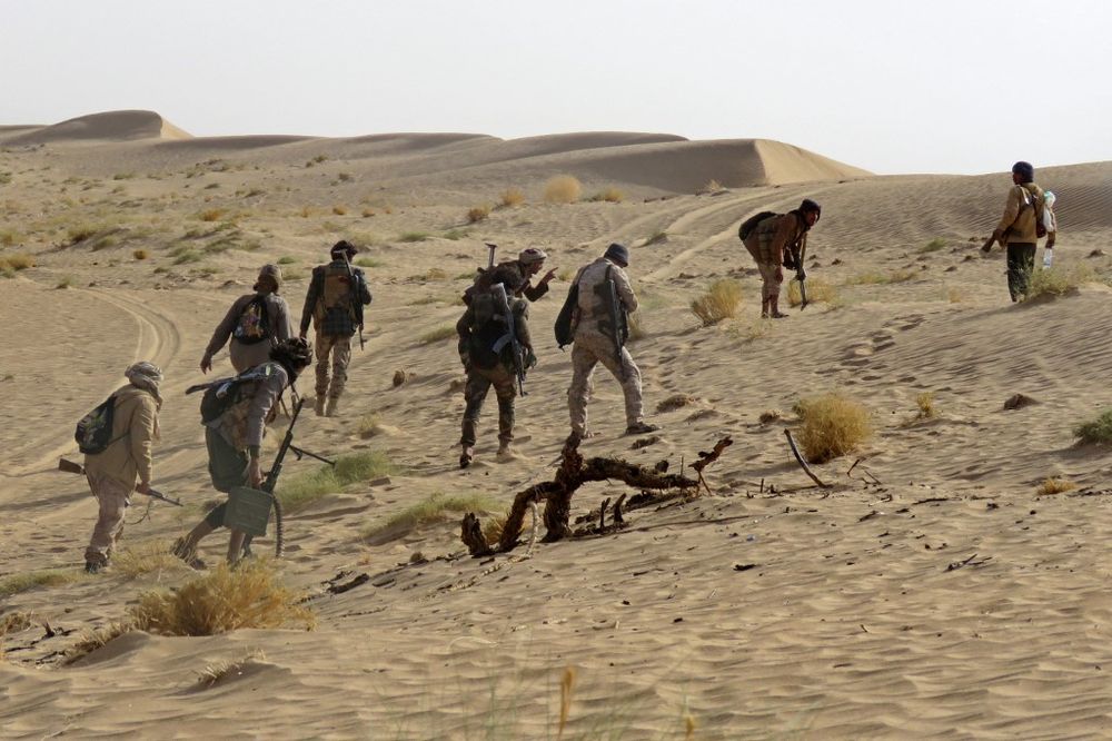 Yemen's pro-government fighters take a position during fighting with Houthi rebels in the south of the strategic governorate of Marib in Yemen on January 4, 2021.