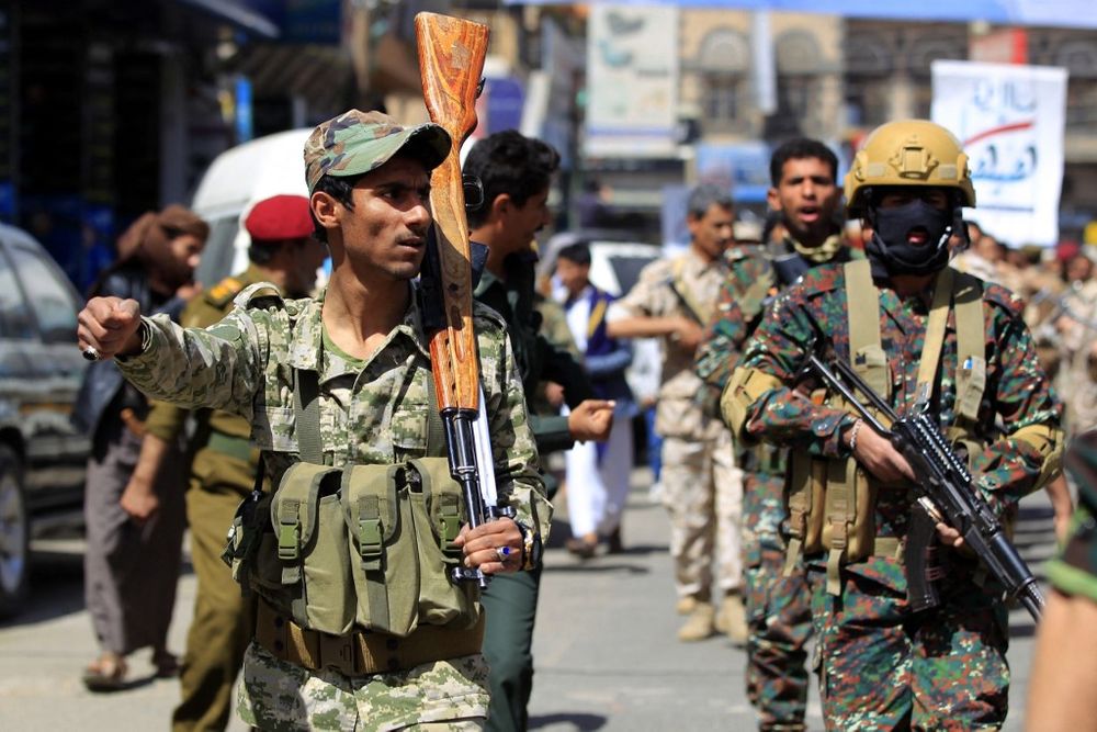 Forces loyal to Yemen's Huthi rebels take part in a military parade marking the seventh anniversary of the Saudi-led coalition's intervention in their country, in the capital Sanaa, on March 31, 2022.