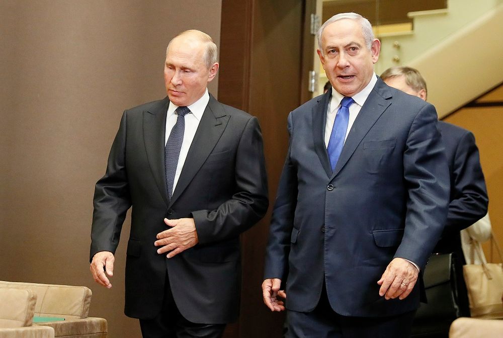Russian President Vladimir Putin, left, and Israeli Prime Minister Benjamin Netanyahu enter the hall during their meeting in Sochi, Russia, Thursday, Sept. 12, 2019.