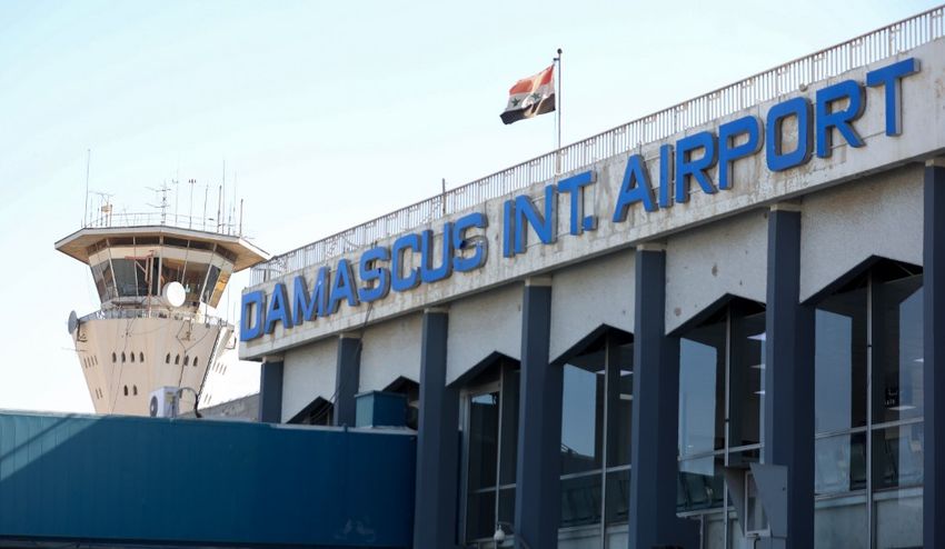 A picture shows the Syrian flag swaying in the wind at the Damascus International airport in the Syrian capital on October 1, 2020.