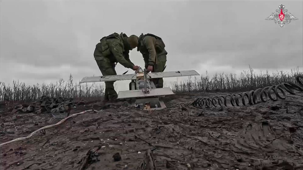 Russian soldiers prepare a drone to launch it towards Ukrainian positions on an undisclosed location in Ukraine